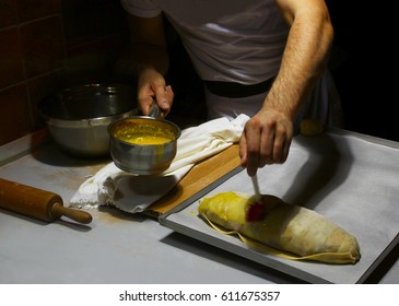 Cook making pie in kitchen