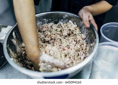 Cook Is Making Tuna Salad With Hands.