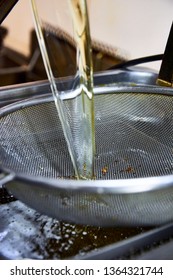 Cook Pouring (refilling) Liters Of Refined Oil For Deep Fat Frying In Electric Modern Heating Machine. Unhealthy Fat Not Organic Vegetable Refined Sunflower Light Greasy Oil, Palmolein, Hydrogenated.