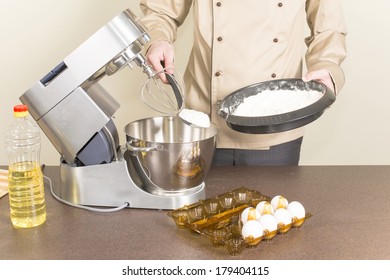 Cook Prepares Dough For Pancakes On A Food Processor