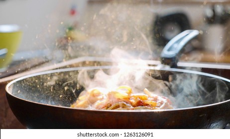 Cook Put Basil Leafs On Spaghetti With Red Tomato Sauce In The Frying Pan, Close-up.