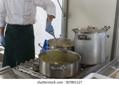 Cook Stirring Risotto Milanese With Safran