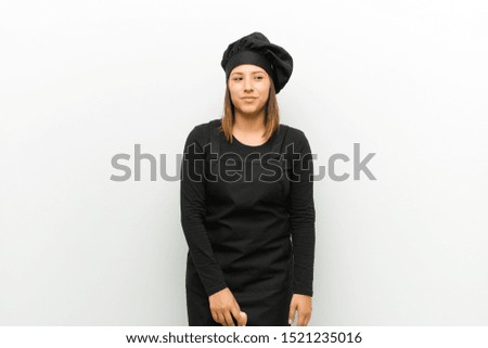 cook woman looking goofy and funny with a silly cross-eyed expression, joking and fooling around against white background