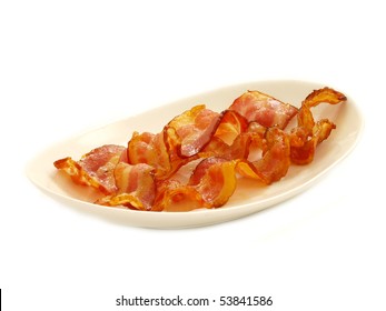 Cooked Bacon In Plate Isolated