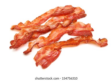 Cooked bacon rashers isolated on white.