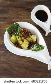 Cooked Bok Choy Or Chinese Cabbage With Sesame AndÂ  Soy Sauce. Simple Background. Healthy Food. Lifestyle