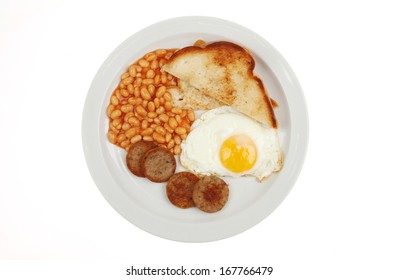 Cooked breakfast on a plate viewed from above isolated against white