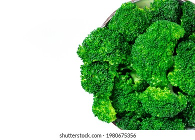 Cooked Broccoli Close-up, Overhead Shot On A White Background With Copy Space