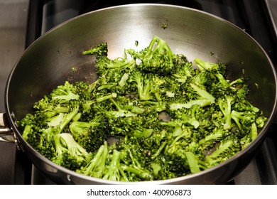 Cooked Broccoli In Stainless Steel Frying Pan On Stove