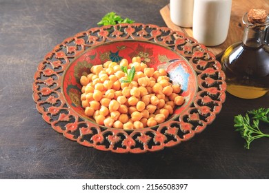 Cooked Chick Peas In A Beautiful Authentic Plate. Spilled Chick Peas. Top View