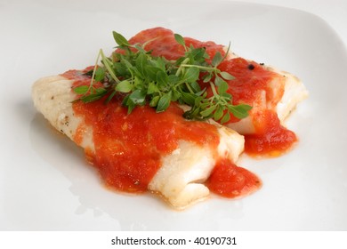 Cooked Cod Loins With Home Made Tomato Sauce