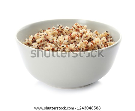 Cooked delicious quinoa in bowl isolated on white