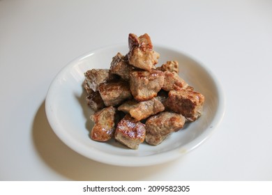 Cooked Diced Beef, On A White Small Plate, Isolated On White Background