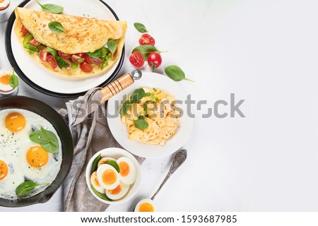 Cooked egg dishes for breakfast. Tradidional Ways to Cook an Egg. Top view with copy space