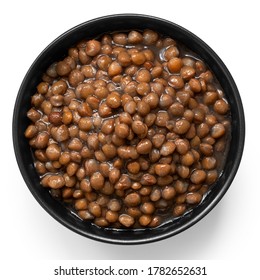 Cooked French Green Puy Lentils In Black Ceramic Bowl Isolated On White. Top View.