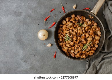 Cooked Fried liver in pan on rustic background, giblets food