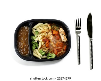 Cooked Frozen Dinner With Knife And Fork