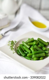 Cooked Green Beans With Olive Oil On The White Plate