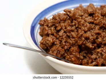 Cooked Ground Beef In A Bowl With A Spoon