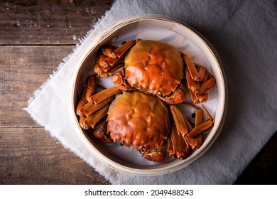 Cooked hairy crabs, Chinese hairy crabs in bamboo steamer, Chinese cuisine - Shutterstock ID 2049488243