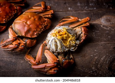 Cooked hairy crabs on the table, Closeup. The hairy crab and rich crab cream. - Shutterstock ID 2049486818