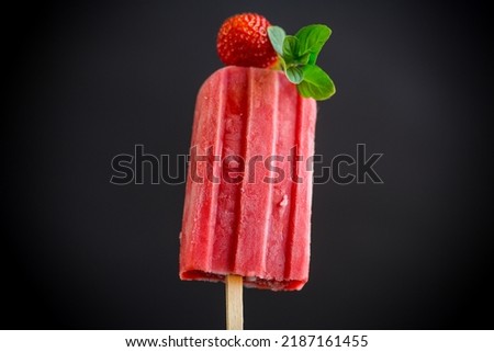 Similar – Foto Bild Erdbeer-Popsicle auf schwarzem Stein