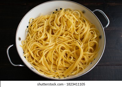 Cooked Linguine Drained In A Colander: Noodles Al Dente And Drained In An Enamel Colander