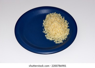 Cooked Long Grain White Rice On A Blue Plate