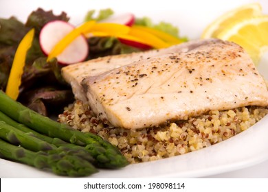 Cooked Mahi Mahi Fish Fillet Dish On Quinoa With Vegetables 