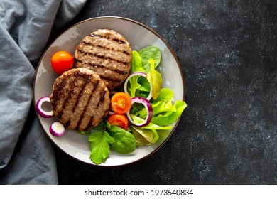 Cooked Minced Beef Patty With Vegetables, Dark Background