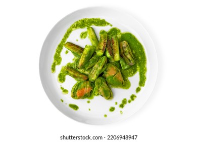 Cooked Mussels In Green Sauce. Balanced, Nutritious, Tasty And Nutritious Food. Ready-made Menu For A Restaurant Or For Delivery. Dish In A White Plate Isolated On A White Background.