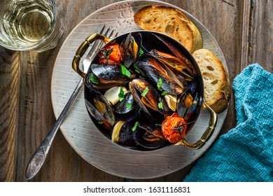 Cooked mussels in steamer pot. 