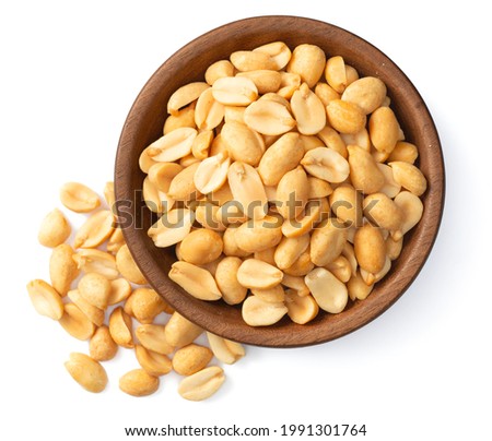 cooked peanuts in the wooden plate, isolated on white background, top view