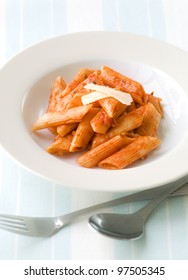 Cooked Penne Pasta With Cheese Garnishing