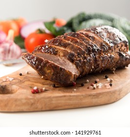 Cooked Pork Loin Roast With Vegetables And Spices