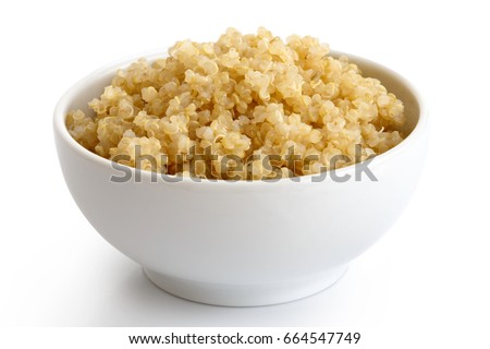 Cooked quinoa in white ceramic bowl isolated on white. 
