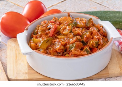 Cooked Ratatouille In A Dish With Fresh Vegetables