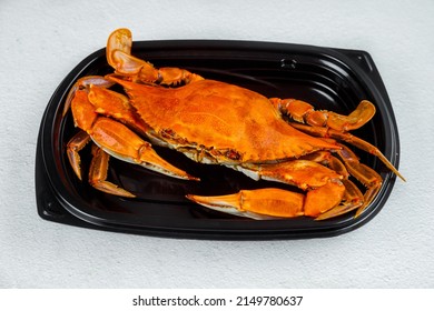 Cooked Red Crab On Black Plastic Plate On Gray Background.