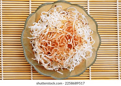 Cooked rice noodles with spices in a bowl, top view - Shutterstock ID 2258689517