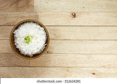 Cooked Rice On Wood Table At Top View