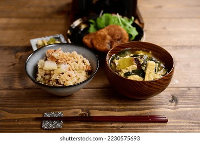 cooked rice with yam and tuna and croquette - Shutterstock ID 2230575693