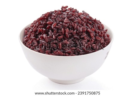 Cooked riceberry in a white bowl isolated on white background. Riceberry rice is dark purple rice similar to ripe berries, rich in nutrients and has good anti-oxidant properties.