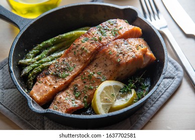 Cooked Salmon In Iron Skillet With Asparagus