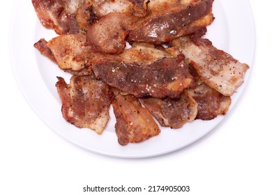 Cooked Slices Of Bacon On White Ceramic Plate Isolated On White Background