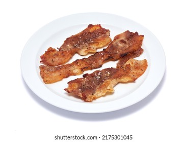 Cooked Slices Of Bacon On White Ceramic Plate Isolated On White Background