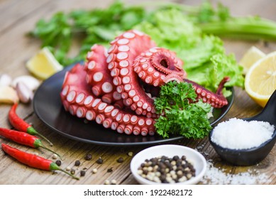 cooked squid salad chili sauce seafood cuttlefish dinner restaurant, Boiled octopus tentacles, Octopus food on wooden background 