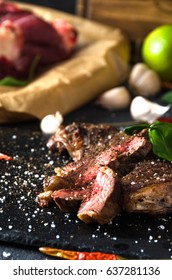 Cooked steak lime pepper garlic on dark background selective focus salt - Shutterstock ID 637281136