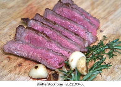 Cooked Strip Steak With Garlic And Rosemary