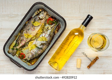 Cooked Trout Fish With Glass And Bottle White Wine