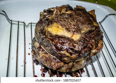 Cooked Two Bone Standing Rib Beef Roast On Rack In Roasting Pan